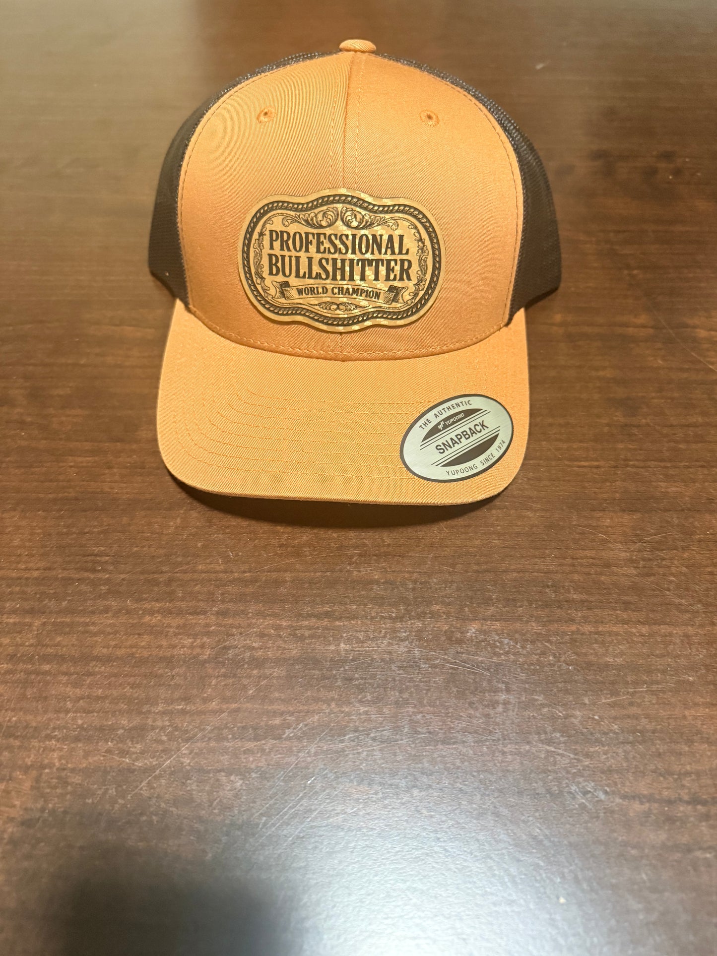 Professional Bullshitter – World Champion Leather Patch Trucker Hat