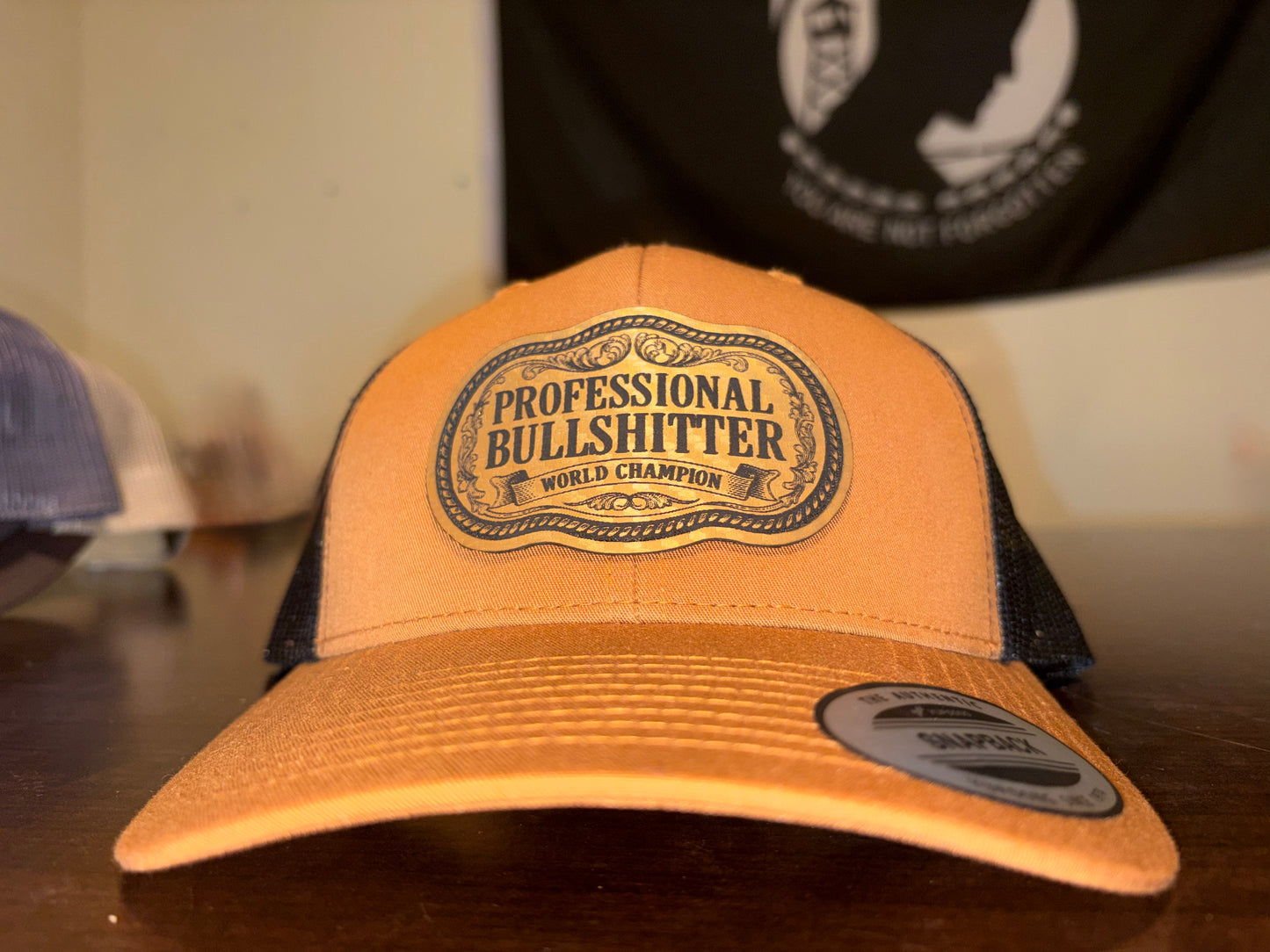 Professional Bullshitter – World Champion Leather Patch Trucker Hat