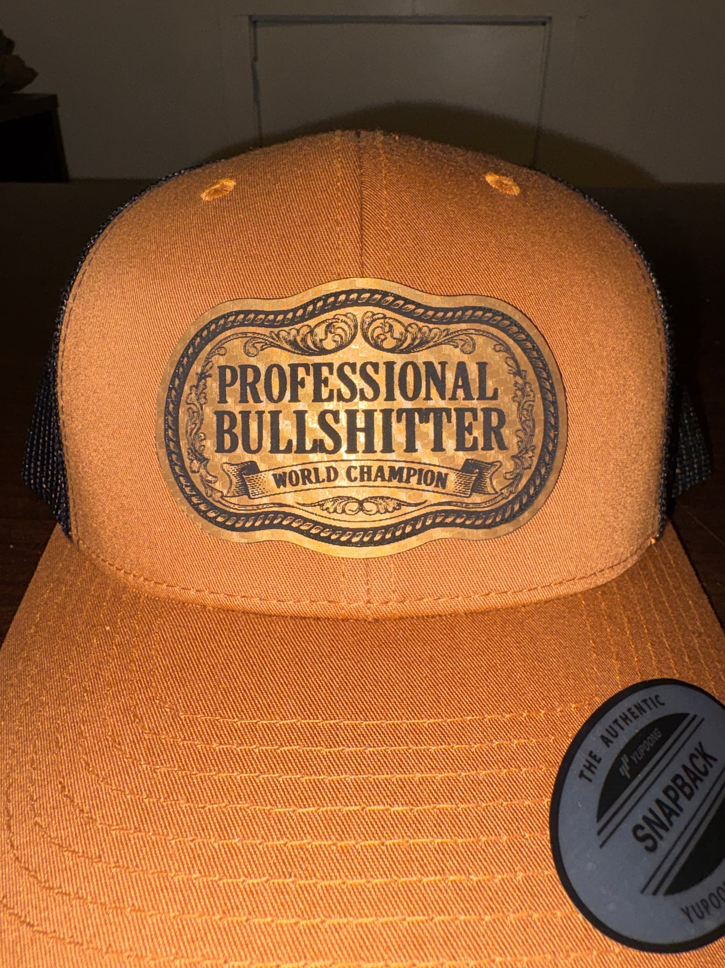Professional Bullshitter – World Champion Leather Patch Trucker Hat